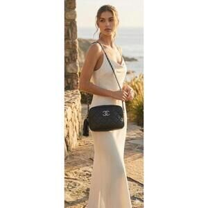 Chanel Quilted Leather CC Logo Tassel Baguette Bag